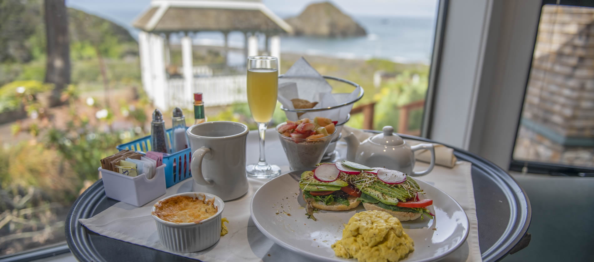 breakfast on tray with oceanview out window