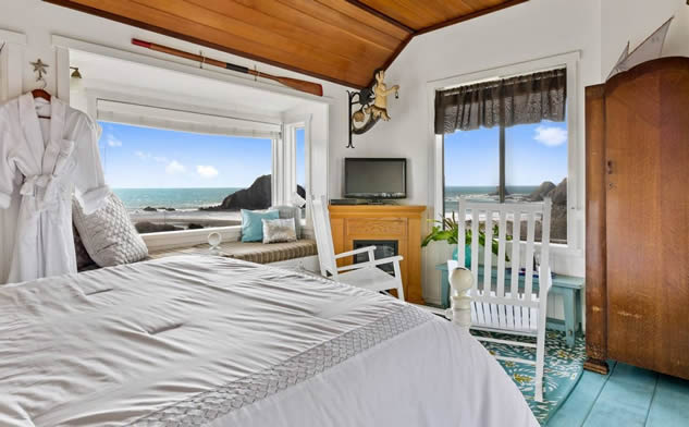 mendocino coast boutique hotel guest room oceanview bed and chairs